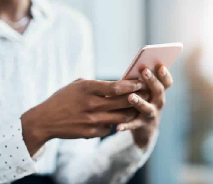 Woman making a mobile deposit on a smartphone