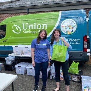 Union Savings Bank employees collecting school supplies.